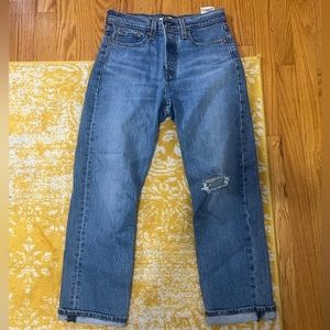 Levi high waisted darker blue Jean - rip in 1 knee